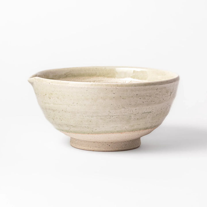 Celadon Japanese suribachi mortar with finely grooved interior and spout for grinding sesame and sauces.