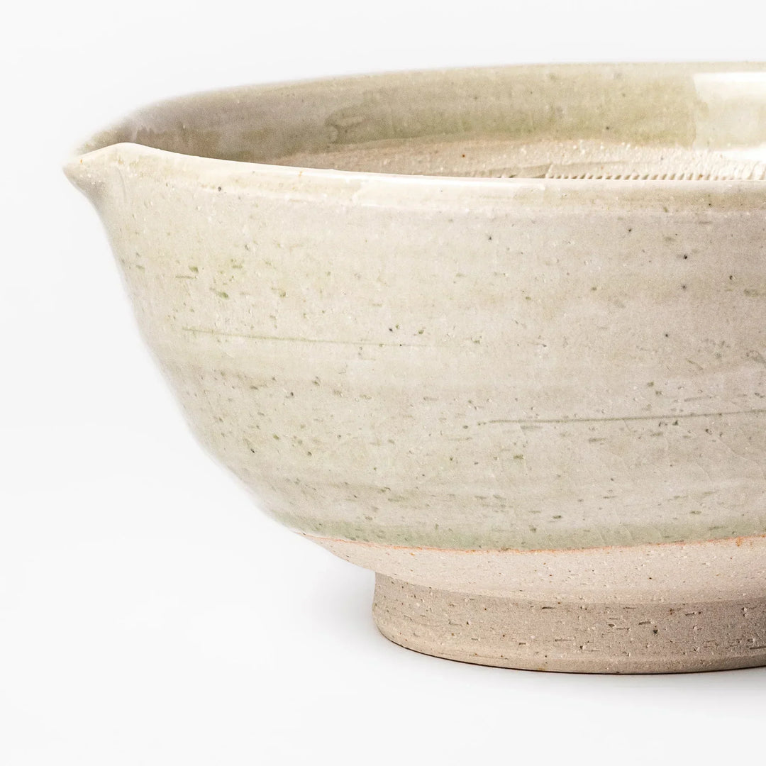 Celadon Japanese suribachi mortar with finely grooved interior and spout for grinding sesame and sauces.