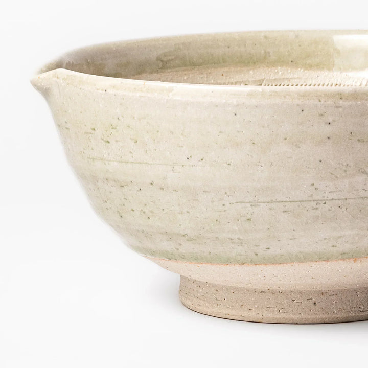 Celadon Japanese suribachi mortar with finely grooved interior and spout for grinding sesame and sauces.