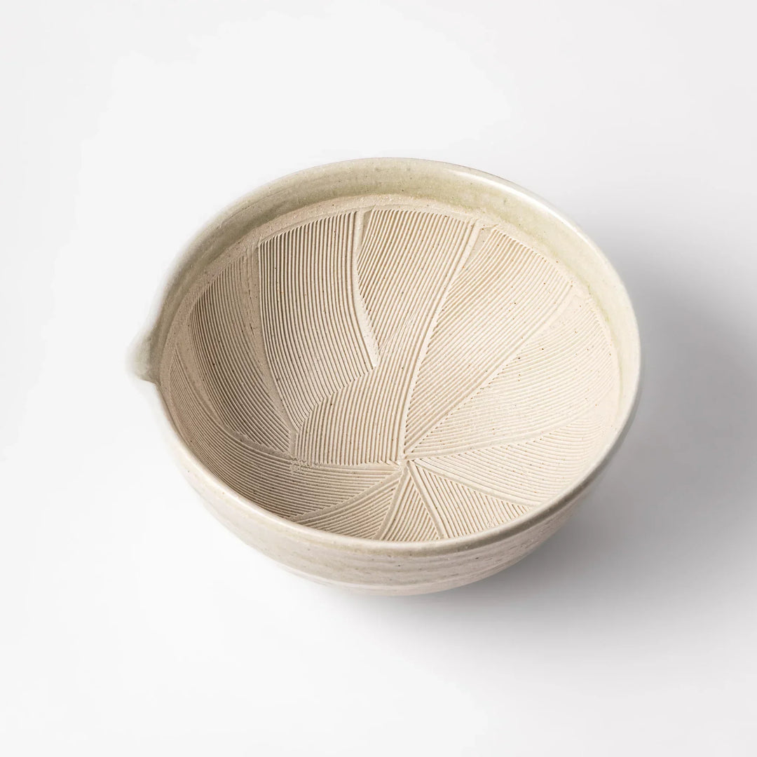 Celadon Japanese suribachi mortar with finely grooved interior and spout for grinding sesame and sauces.