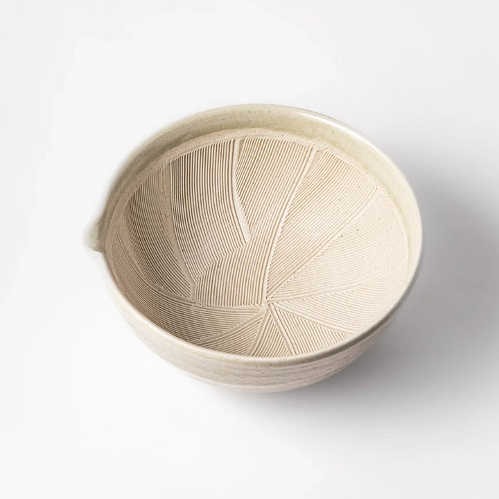 Celadon Japanese suribachi mortar with finely grooved interior and spout for grinding sesame and sauces.