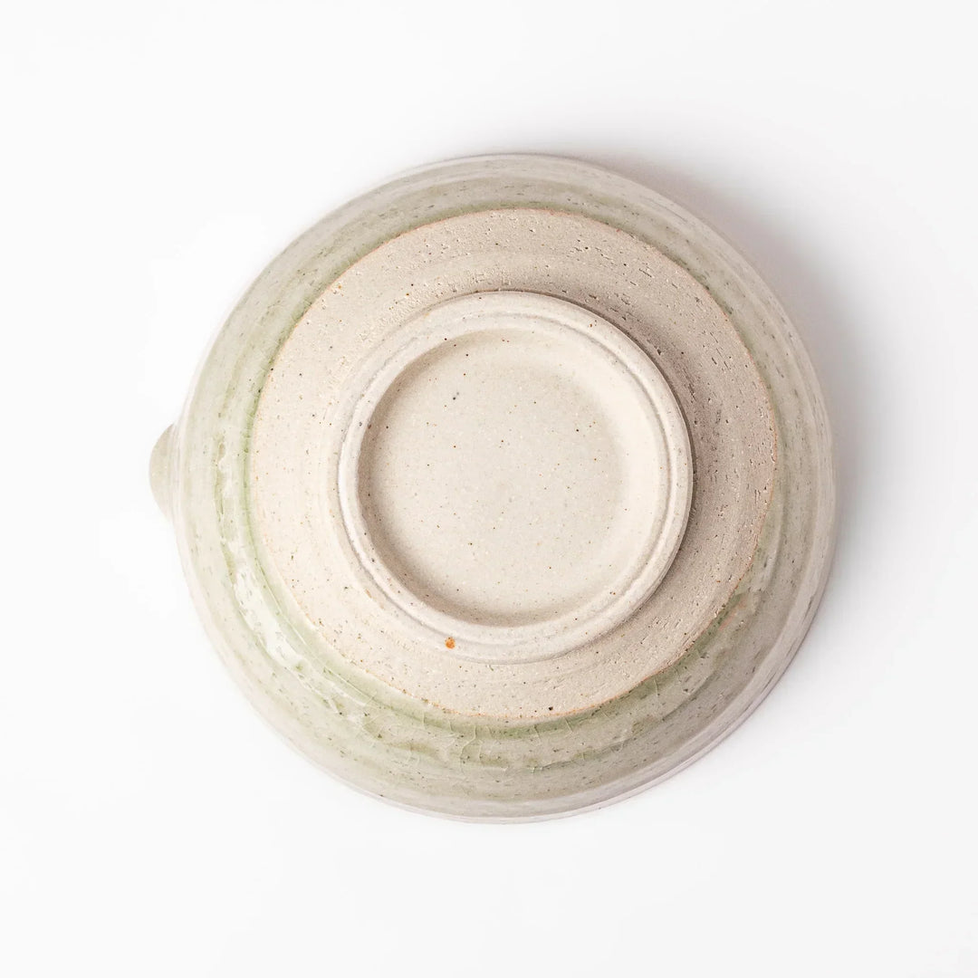 Celadon Japanese suribachi mortar with finely grooved interior and spout for grinding sesame and sauces.