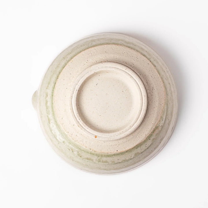 Celadon Japanese suribachi mortar with finely grooved interior and spout for grinding sesame and sauces.