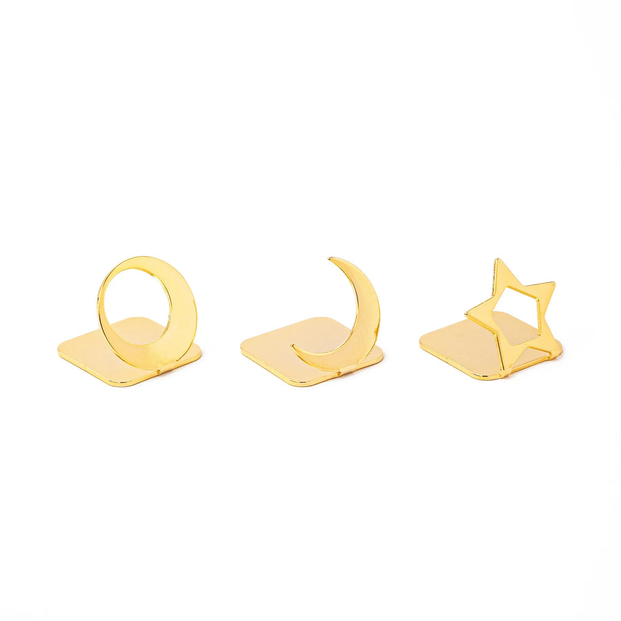Three elegant Japanese celestial gold chopstick rests in unique moon and star shapes luxury metal hashioki set