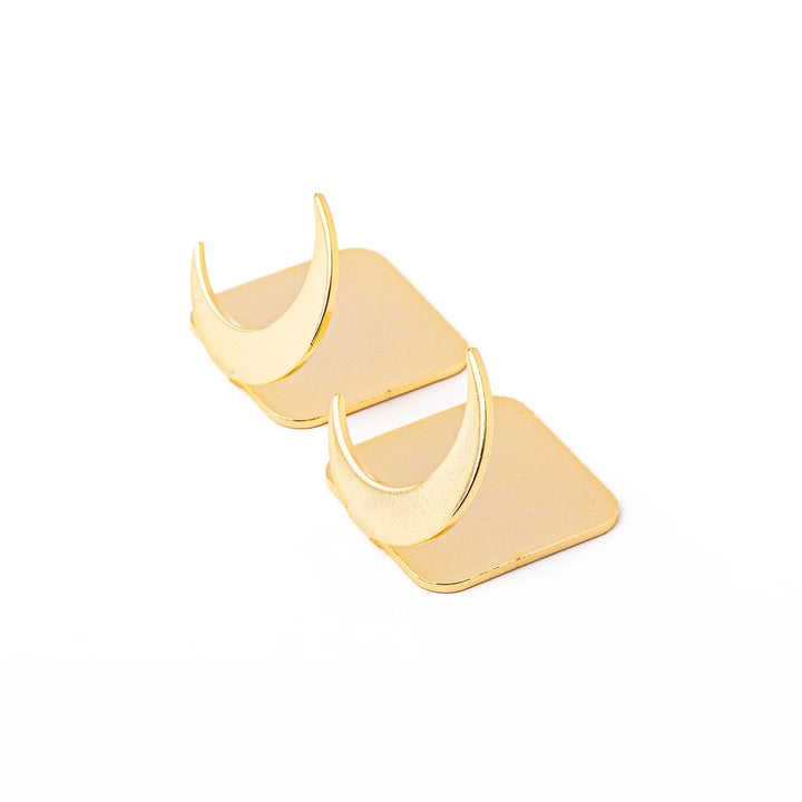 Set of two elegant celestial gold chopstick rests featuring unique crescent moon shapes brass style luxury hashioki