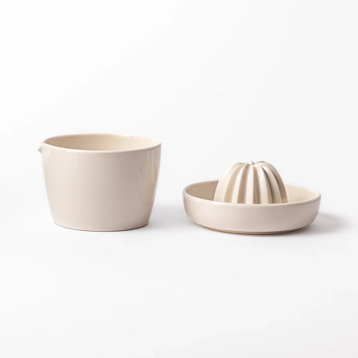 White Japanese ceramic citrus juicer with ridged reamer and strainer for squeezing lemons limes and citrus.