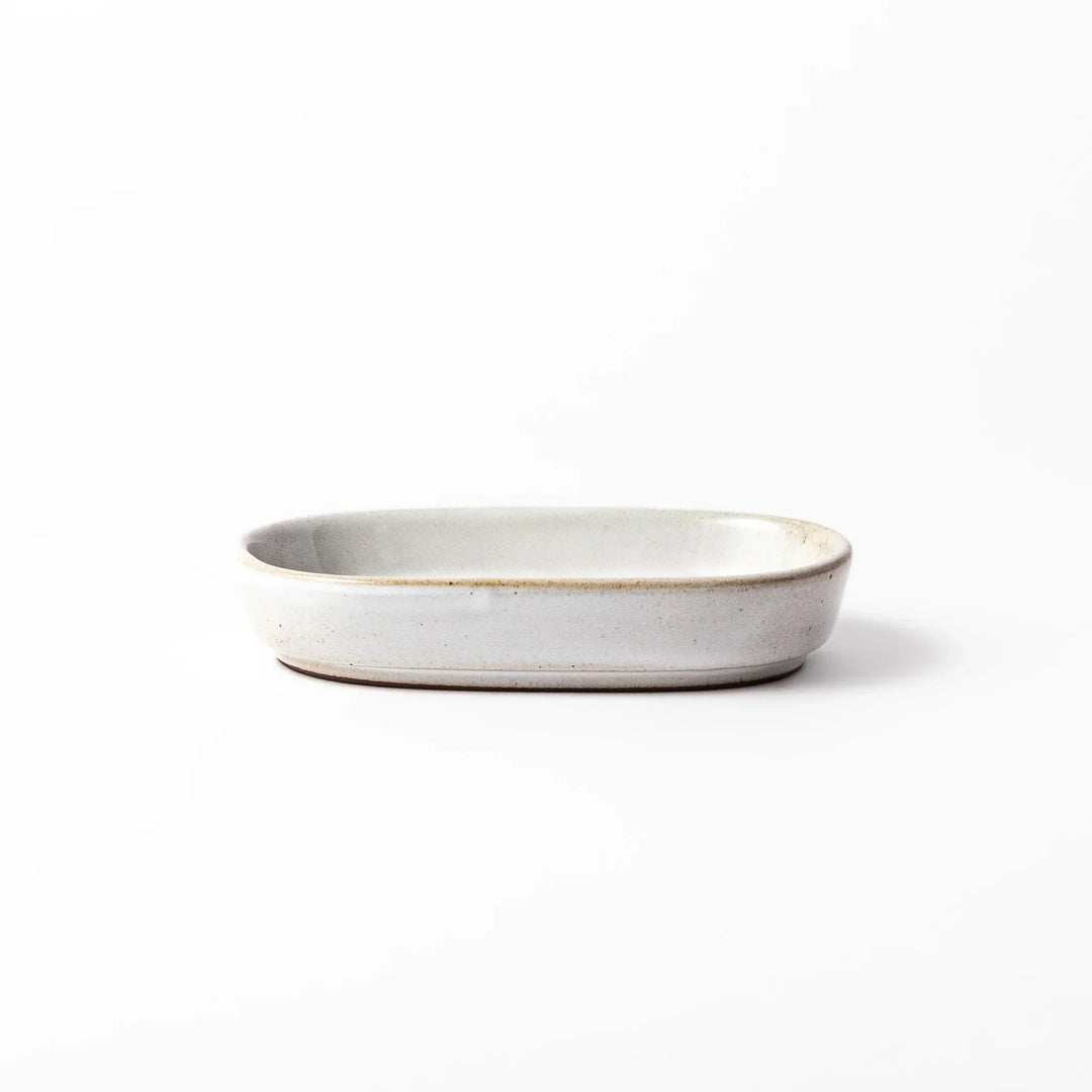 White Japanese ceramic ginger grater dish with natural glaze and raised teeth for grating ginger or garlic.