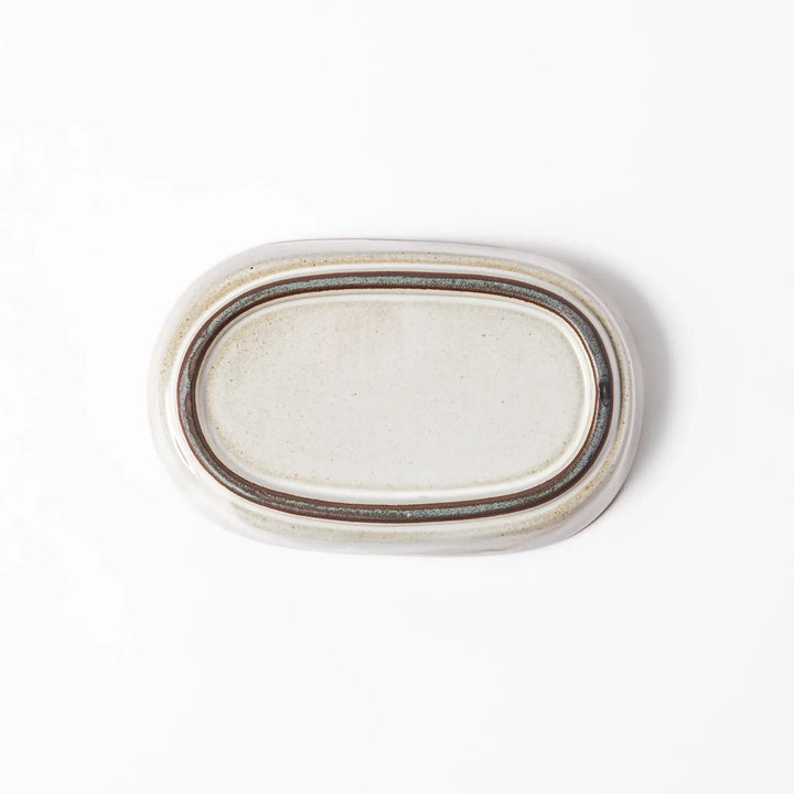 White Japanese ceramic ginger grater dish with natural glaze and raised teeth for grating ginger or garlic.