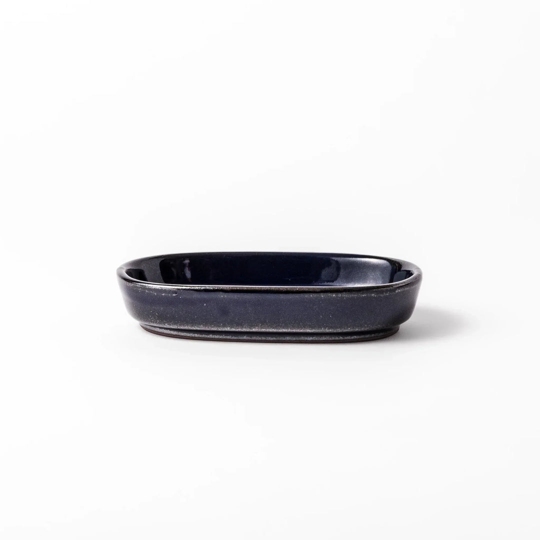 Deep blue Japanese ceramic ginger grater dish with raised teeth and shallow base for grating ginger garlic.