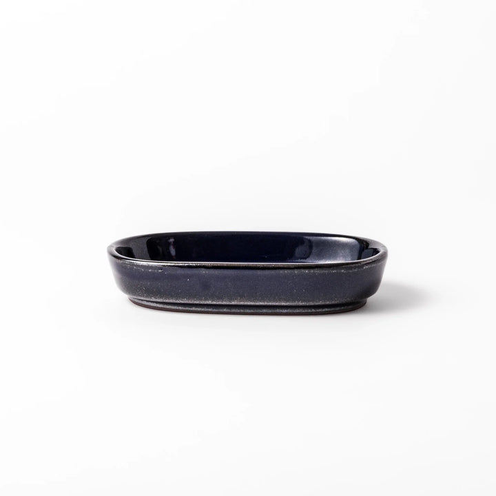 Deep blue Japanese ceramic ginger grater dish with raised teeth and shallow base for grating ginger garlic.