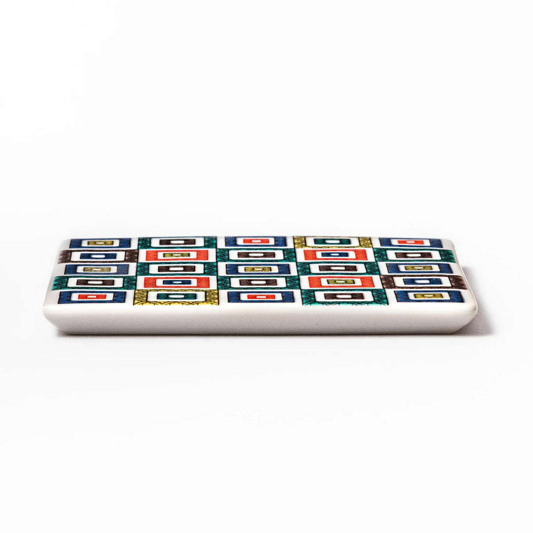 Square Japanese ceramic coaster with colorful cobblestone mosaic pattern in red blue green yellow and black.