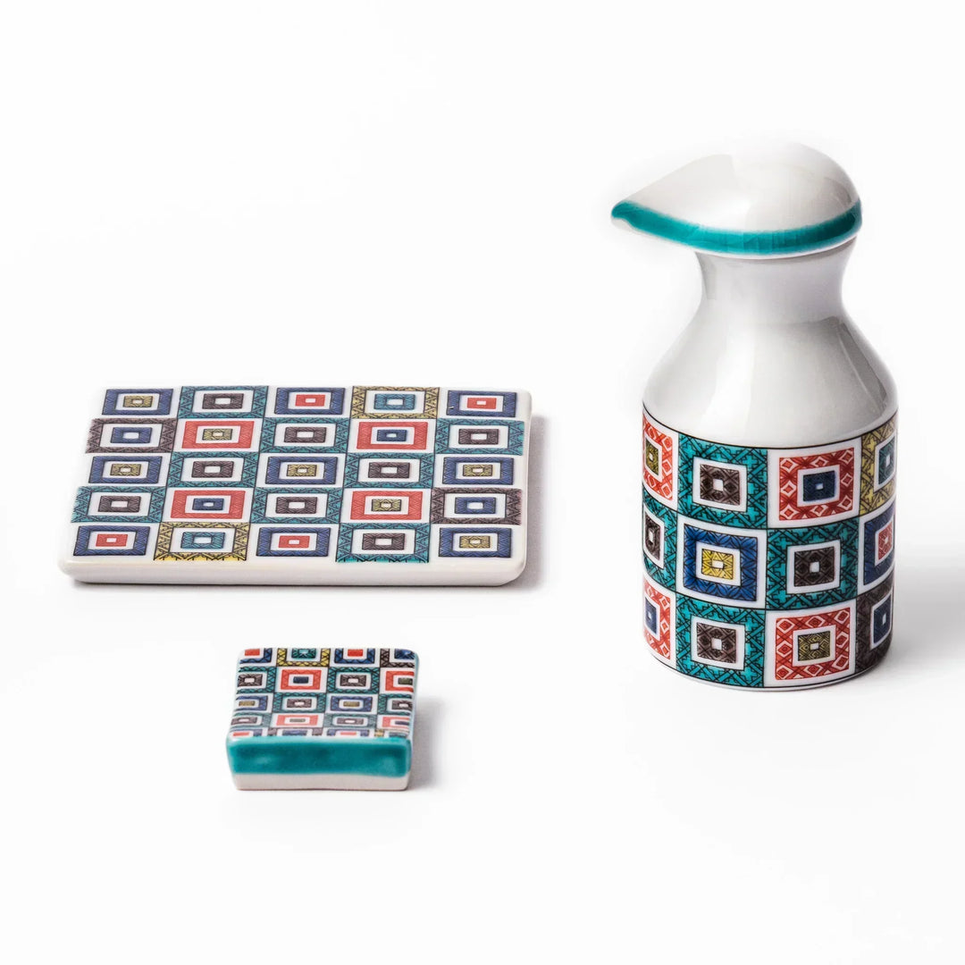 Japanese ceramic tableware set with colorful cobblestone mosaic pattern including dispenser coaster and rest.