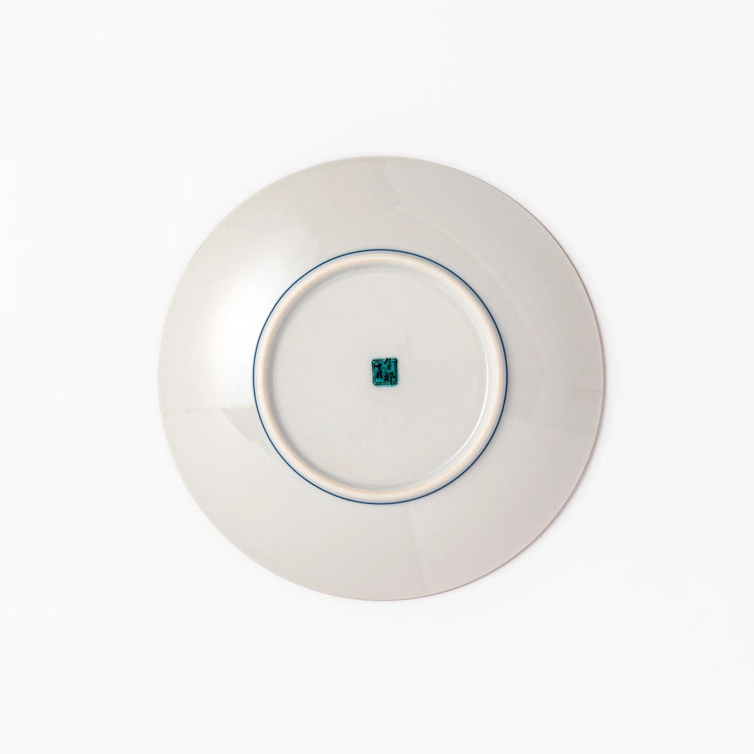 Colorful Japanese porcelain dessert plate with geometric mosaic squares in red green yellow blue and black.