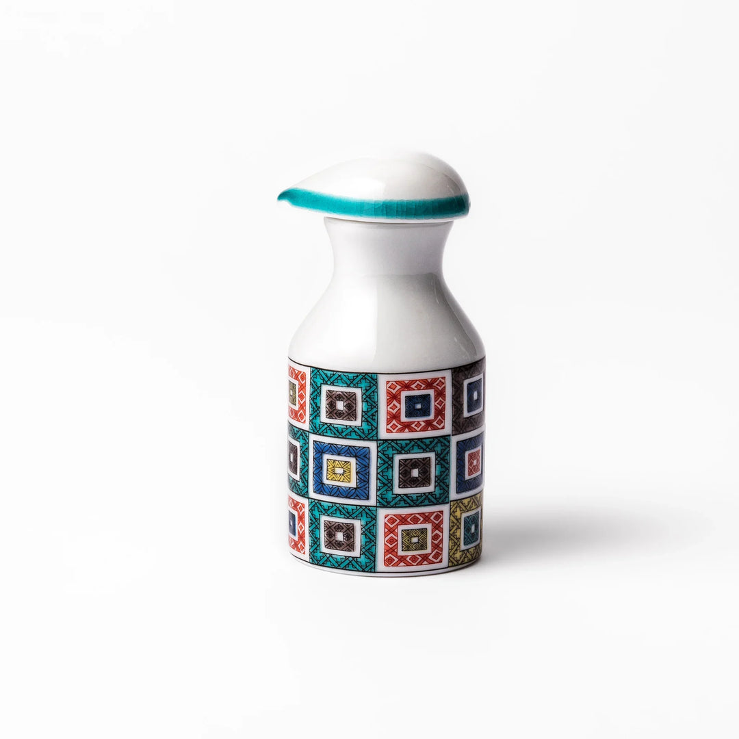 Japanese ceramic soy sauce dispenser with colorful cobblestone mosaic pattern in red green blue and yellow.