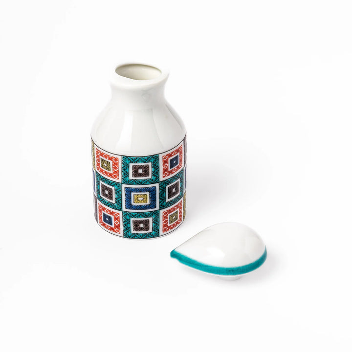 Japanese ceramic soy sauce dispenser with colorful cobblestone mosaic pattern in red green blue and yellow.