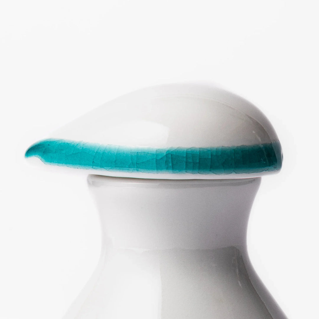 Japanese ceramic soy sauce dispenser with colorful cobblestone mosaic pattern in red green blue and yellow.