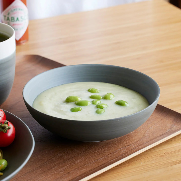 Matte gray Japandi cereal bowl with creamy soup and edamame, adding warmth to your table.