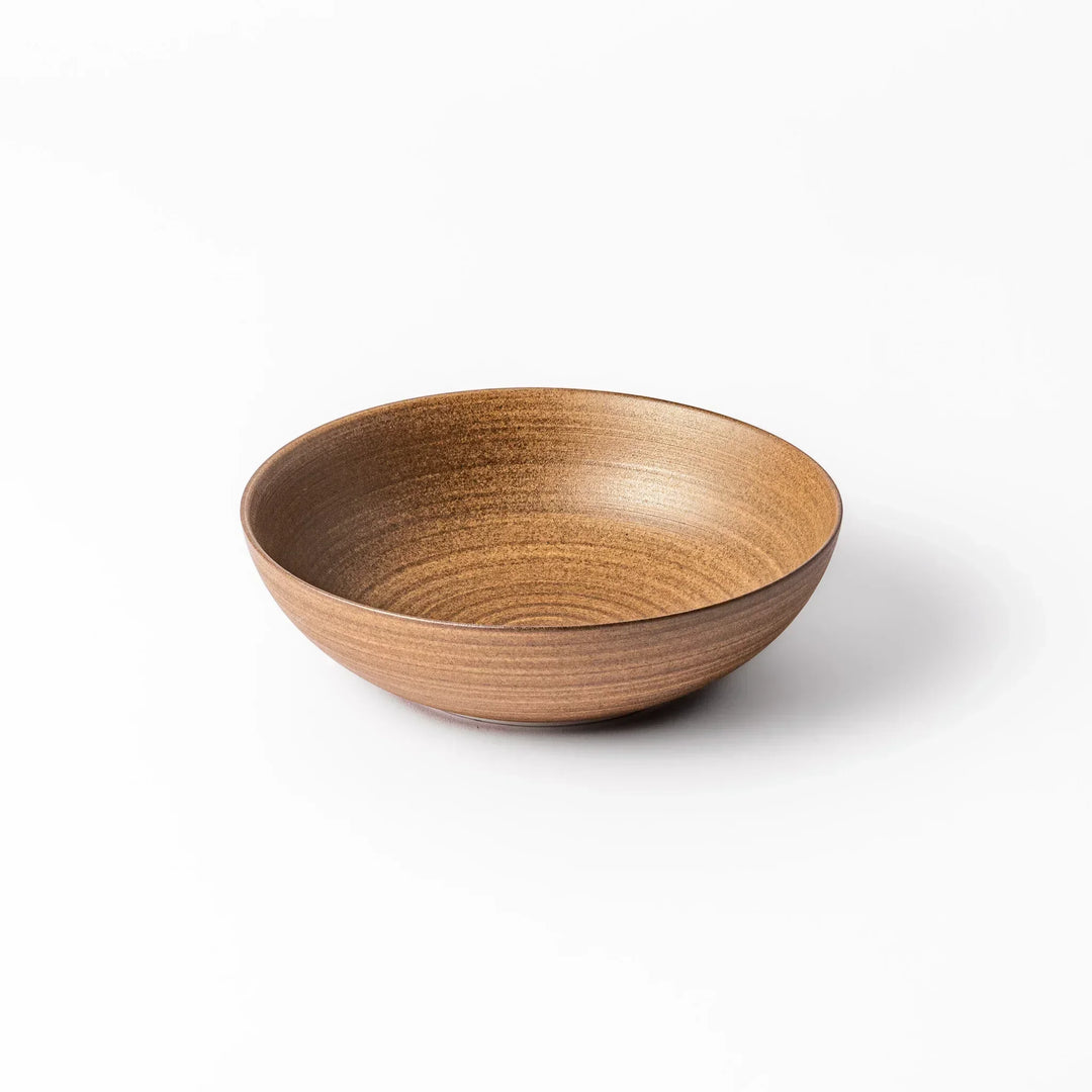Matte beige ceramic bowl with a warm, woodgrain-like texture and softly curved shape, set against a white background.