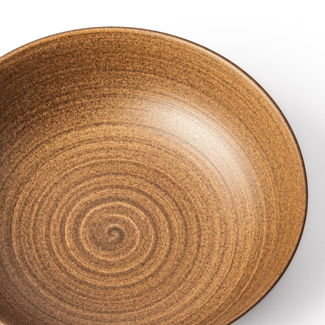 Matte beige ceramic bowl with a warm, woodgrain-like texture and softly curved shape, set against a white background.