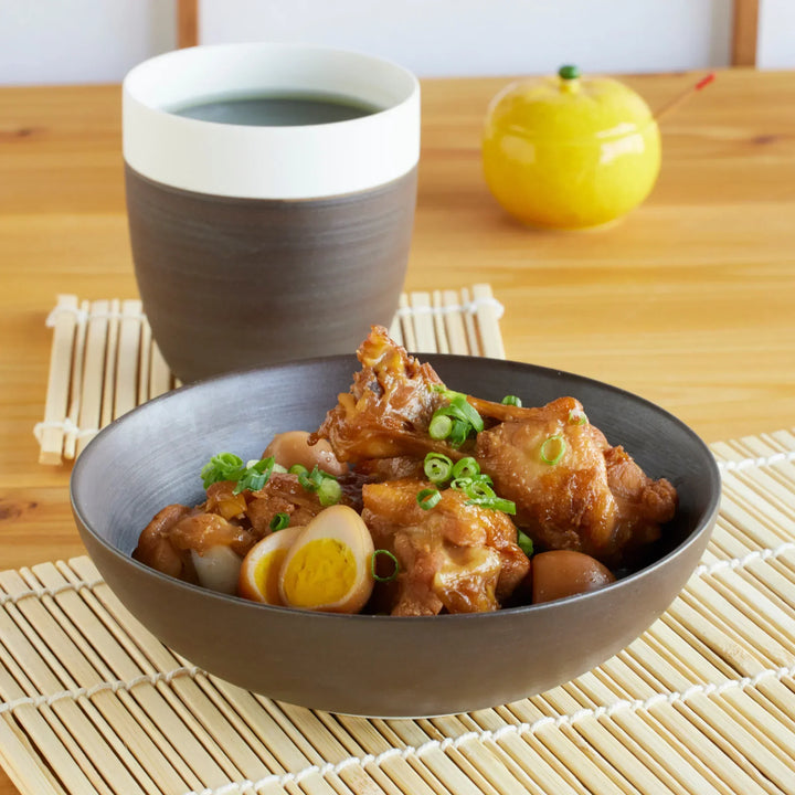 Cozy Japandi Cereal Bowl in matte brown, paired with tea, showcasing a warm Japanese-inspired dining style.