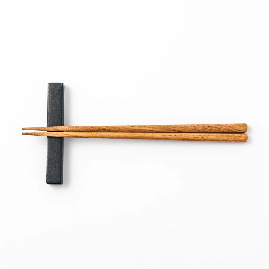 Rectangular ceramic chopstick rest in deep navy with a smooth matte surface and softly rounded edges
