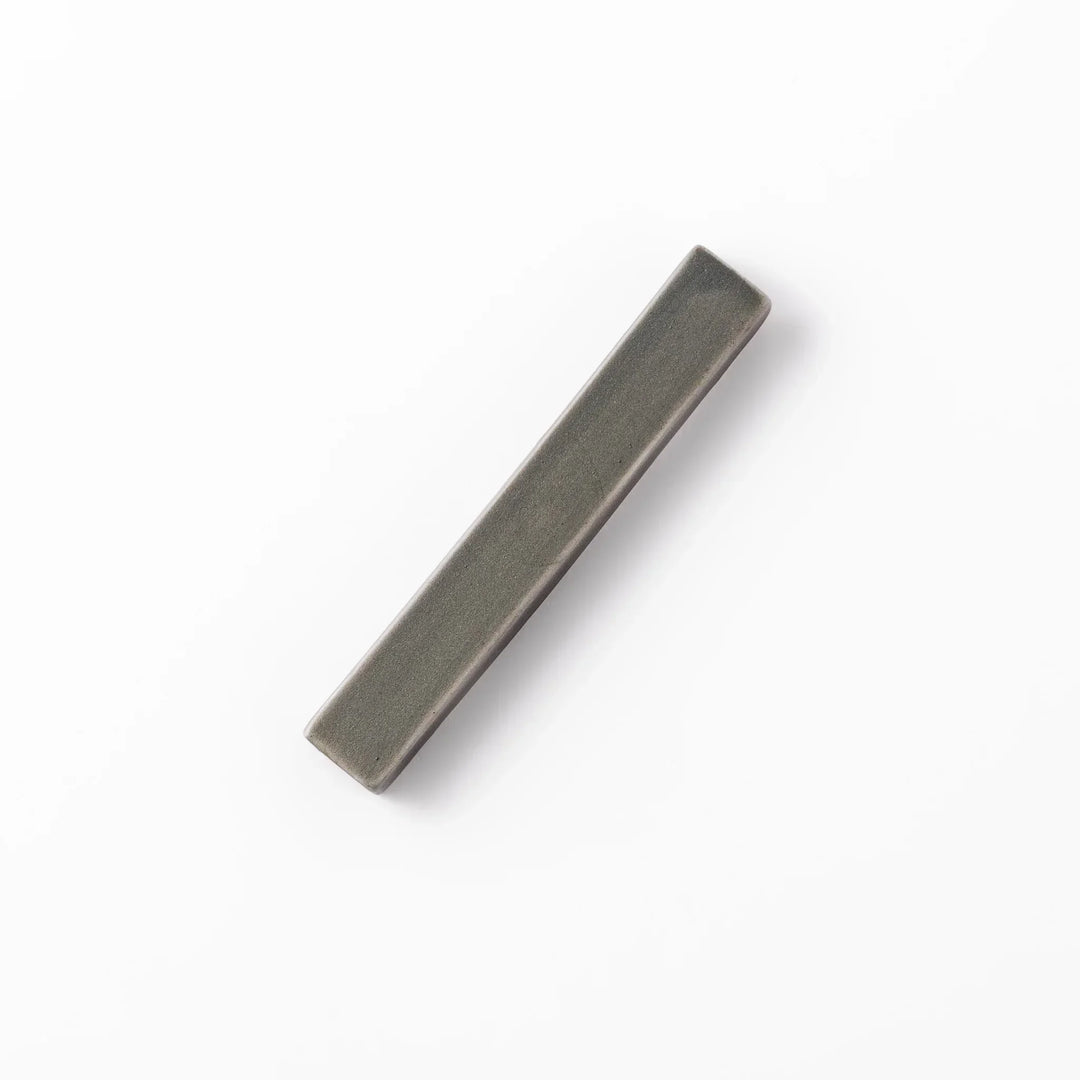 Rectangular ceramic chopstick rest in a soft gray Japandi tone with clean edges and a smooth matte finish
