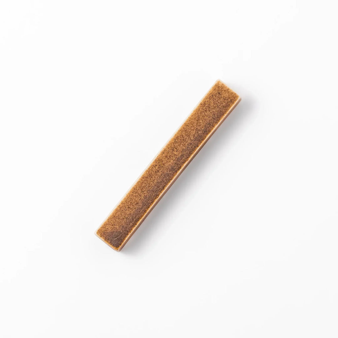 Rectangular ceramic chopstick rest in a warm beige Japandi tone with a minimalist form and smooth glazed finish