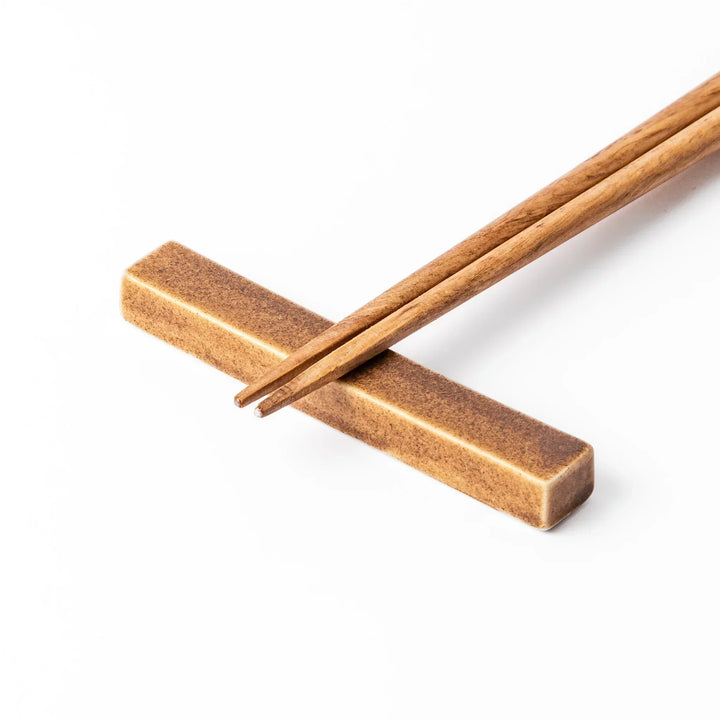 Rectangular ceramic chopstick rest in a warm beige Japandi tone with a minimalist form and smooth glazed finish