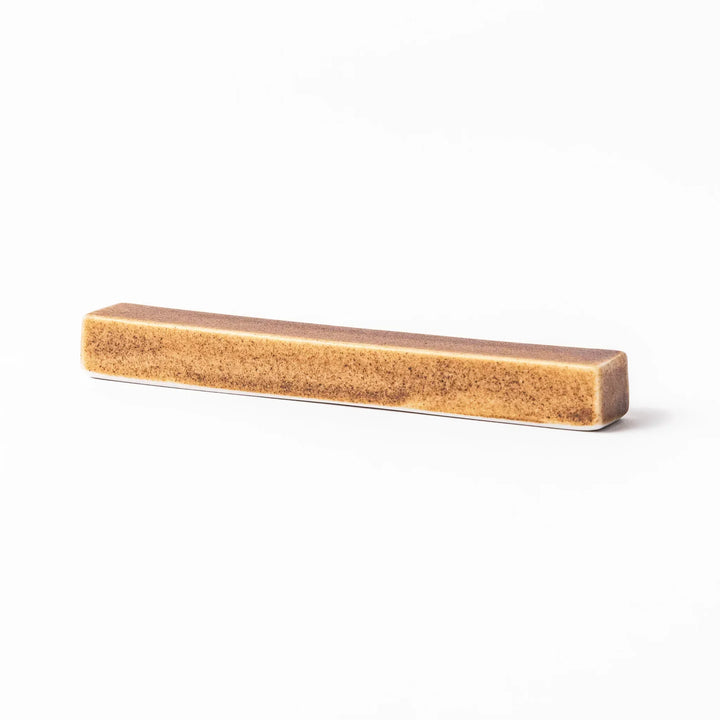 Rectangular ceramic chopstick rest in a warm beige Japandi tone with a minimalist form and smooth glazed finish
