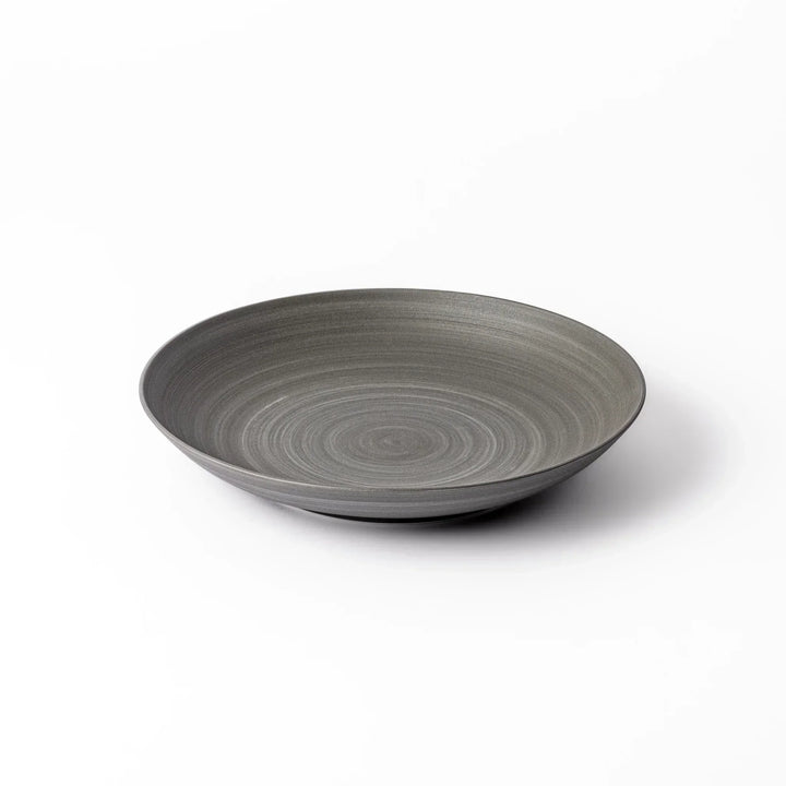 Matte gray salad plate with subtle concentric texture and gently curved sides for a modern Japandi look.