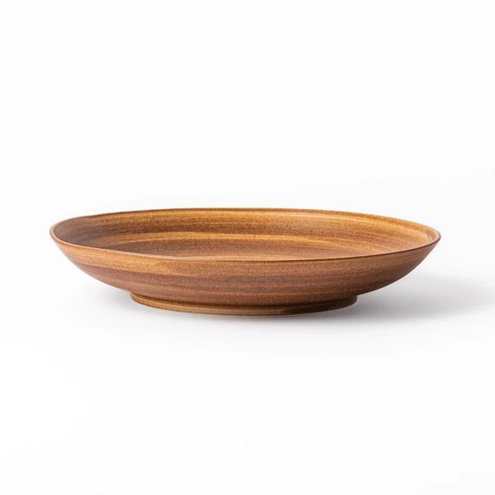 Warm-toned matte brown salad plate featuring soft concentric rings and a gentle curve, perfect for Japandi-style dining.
