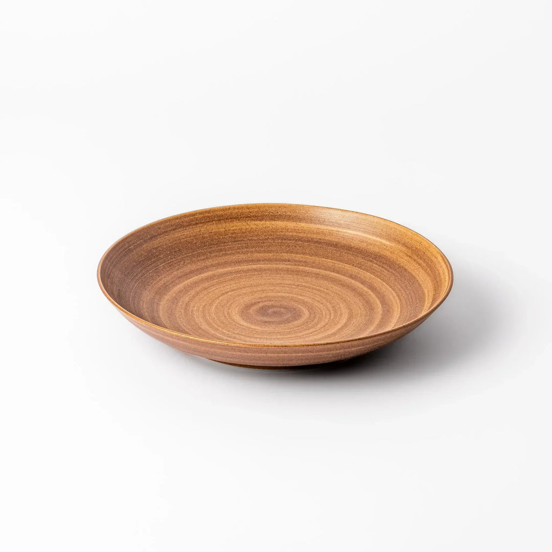 Warm-toned matte brown salad plate featuring soft concentric rings and a gentle curve, perfect for Japandi-style dining.