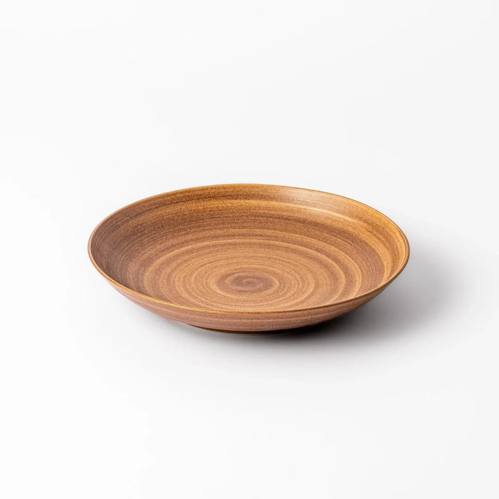 Warm-toned matte brown salad plate featuring soft concentric rings and a gentle curve, perfect for Japandi-style dining.