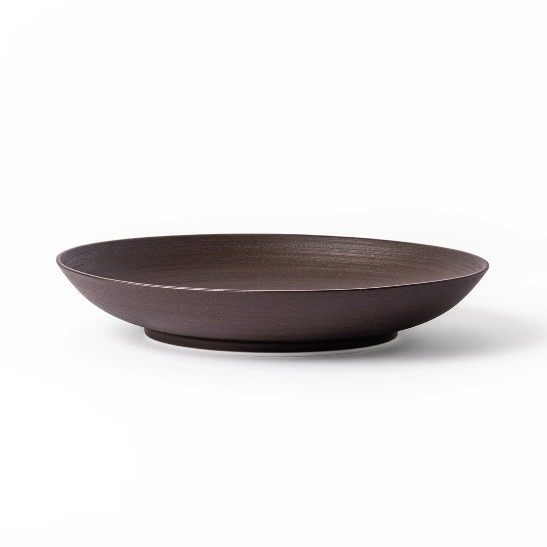 Matte brown ceramic salad plate with subtle swirl lines and a gently raised rim, perfect for modern Japandi table settings.