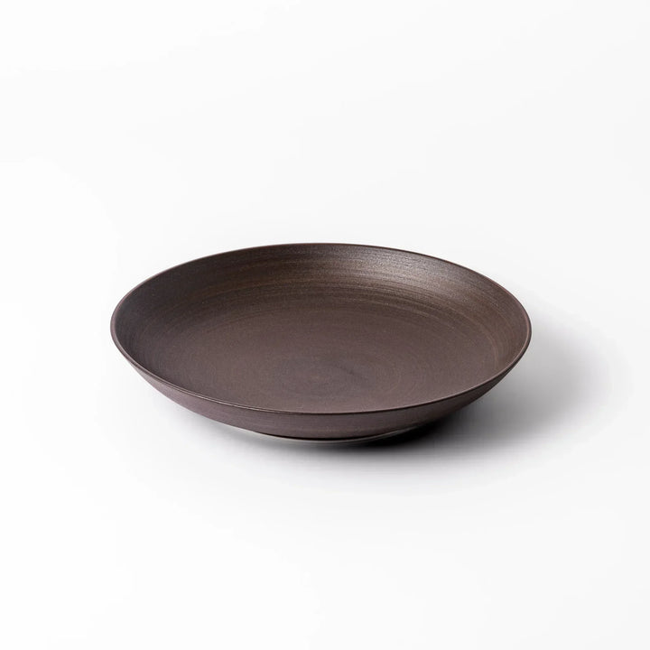 Matte brown ceramic salad plate with subtle swirl lines and a gently raised rim, perfect for modern Japandi table settings.