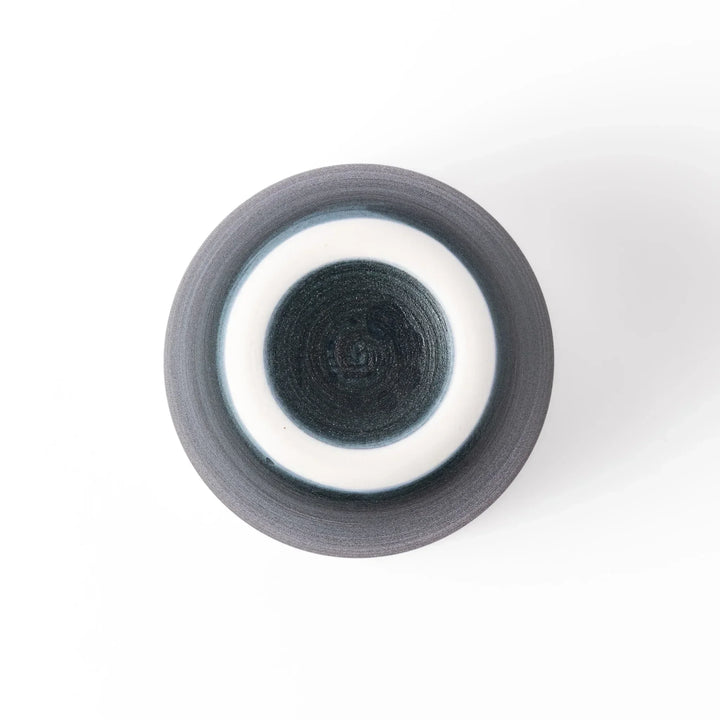 Two-tone tea cup with ivory rim and deep blue base, ideal for serene tea moments in Japandi settings.