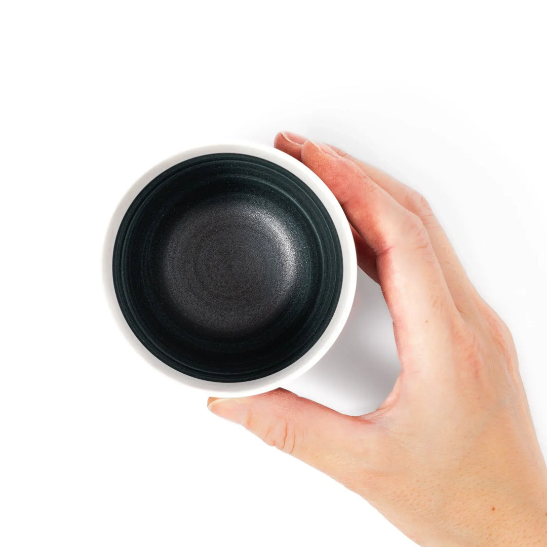 Two-tone tea cup with ivory rim and deep blue base, ideal for serene tea moments in Japandi settings.