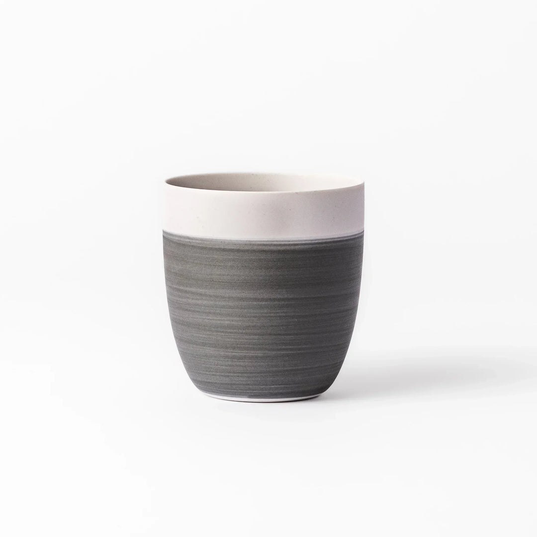 Two-tone tea cup with ivory rim and gray base, ideal for calm tea moments and Japandi tables.