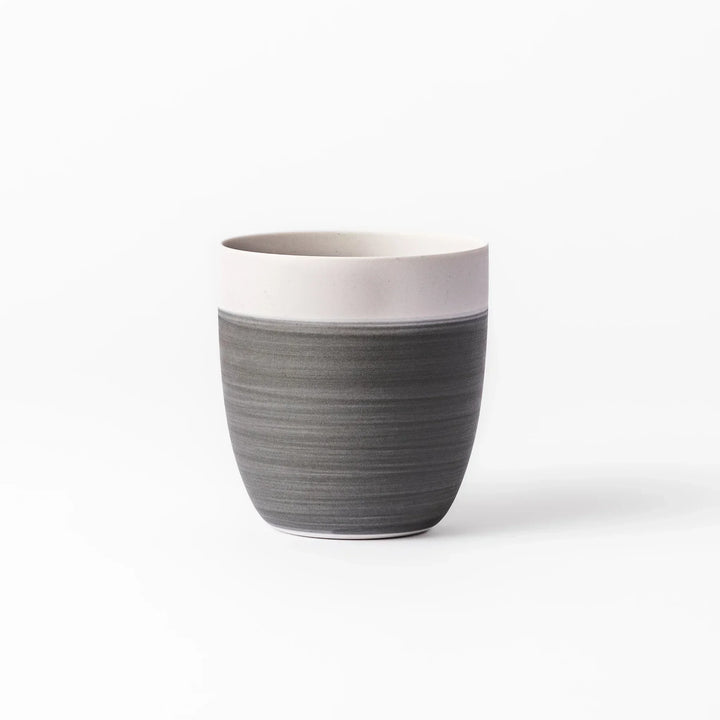 Two-tone tea cup with ivory rim and gray base, ideal for calm tea moments and Japandi tables.