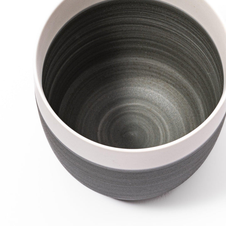 Two-tone tea cup with ivory rim and gray base, ideal for calm tea moments and Japandi tables.