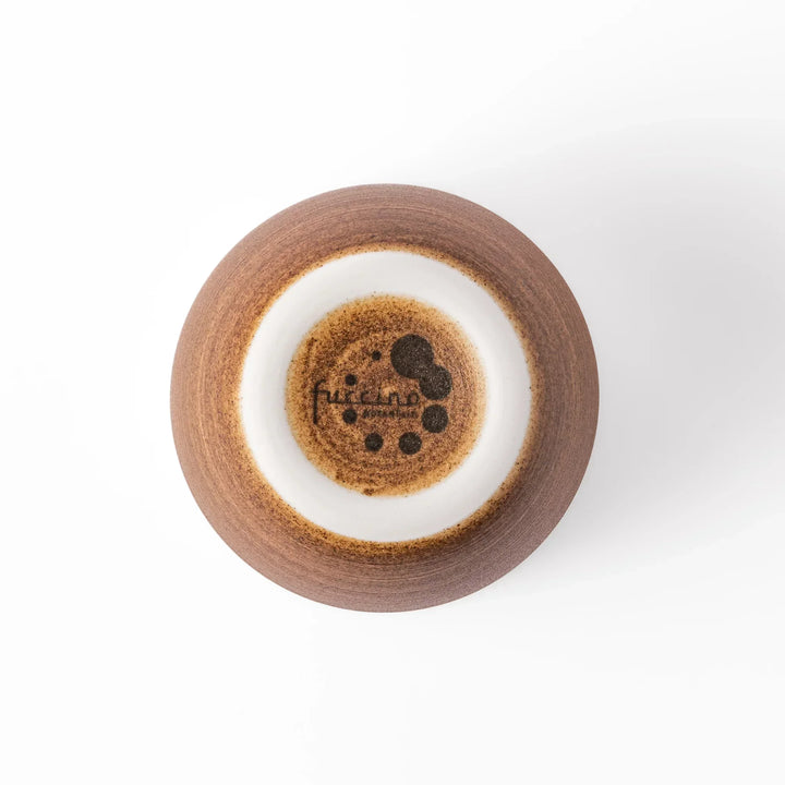 Two-tone ceramic tea cup with a matte ivory rim and warm caramel-toned base. Perfect for cozy sips and Japandi-style tables.