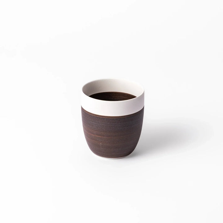 Two-tone tea cup with ivory rim and dark brown base, perfect for warm drinks and daily comfort.
