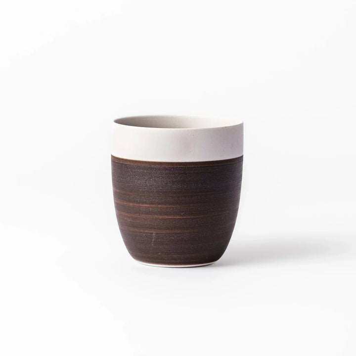 Two-tone tea cup with ivory rim and dark brown base, perfect for warm drinks and daily comfort.