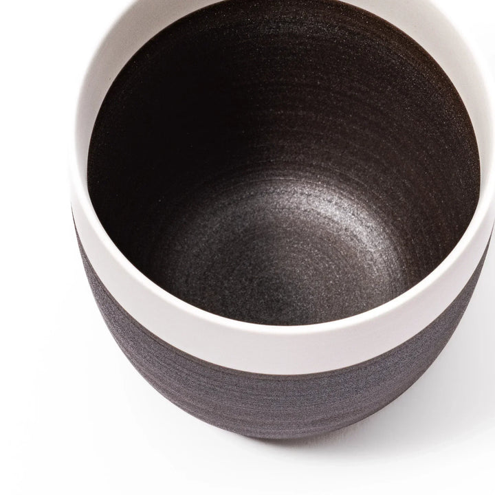 Two-tone tea cup with ivory rim and dark brown base, perfect for warm drinks and daily comfort.