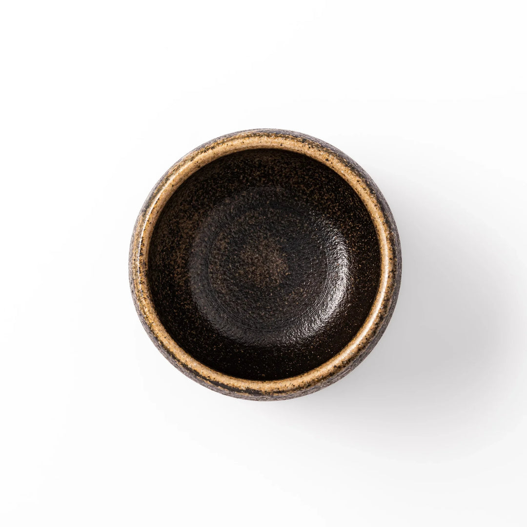 Dark brown ceramic rice storage bowl with lid and rustic texture for storing and serving cooked rice.