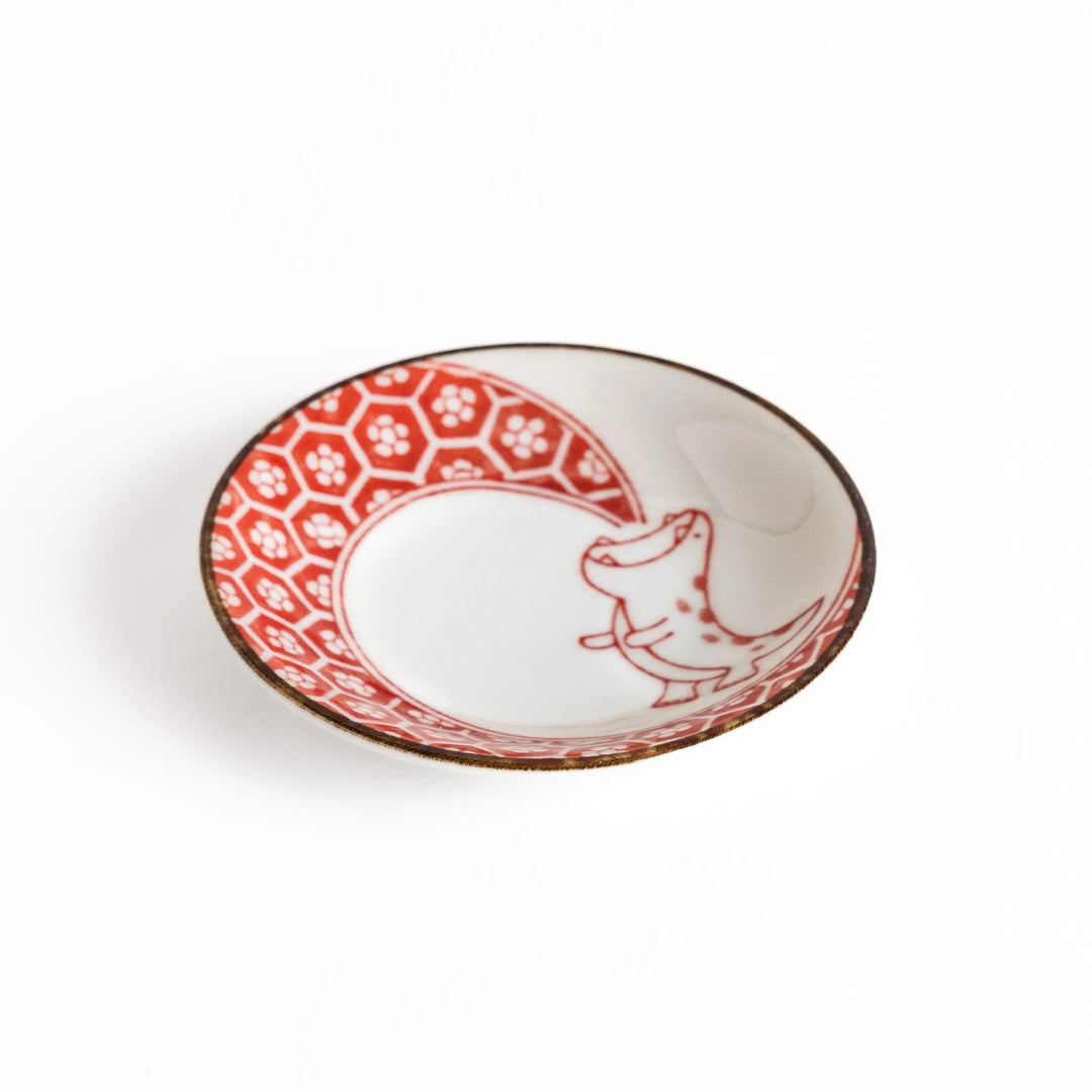 Small dinosaur pattern sauce plate with Japanese geometric motif for a playful dining table accent.