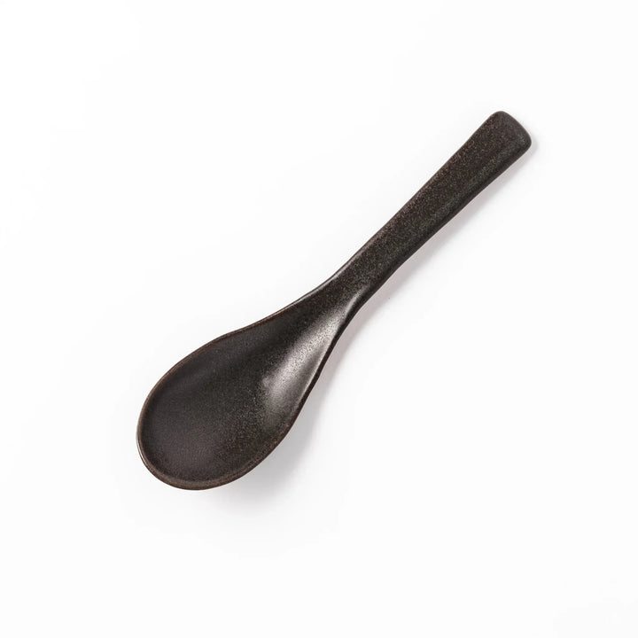 Black Japanese ceramic spoon with smooth rounded bowl and straight handle for serving soup stew or curry.