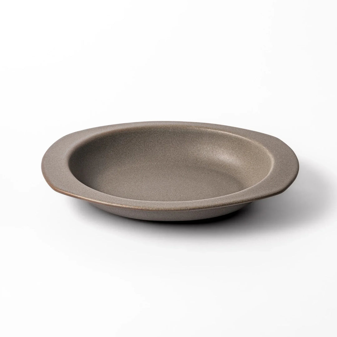 Gray Japanese oval ceramic curry plate with wide rim and raised sides for serving rice curry or stew.