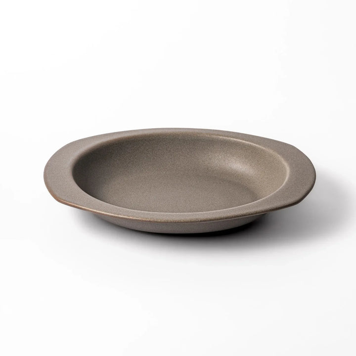Gray Japanese oval ceramic curry plate with wide rim and raised sides for serving rice curry or stew.
