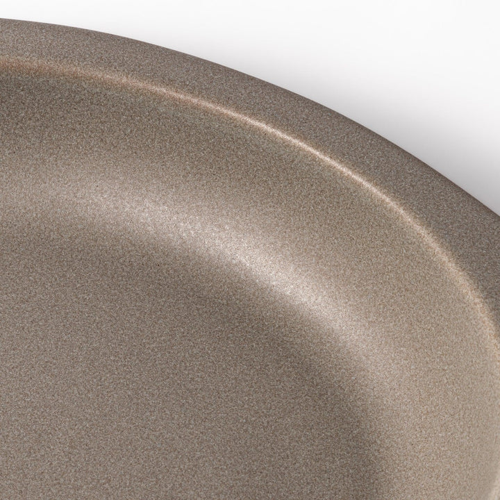 Gray Japanese oval ceramic curry plate with wide rim and raised sides for serving rice curry or stew.